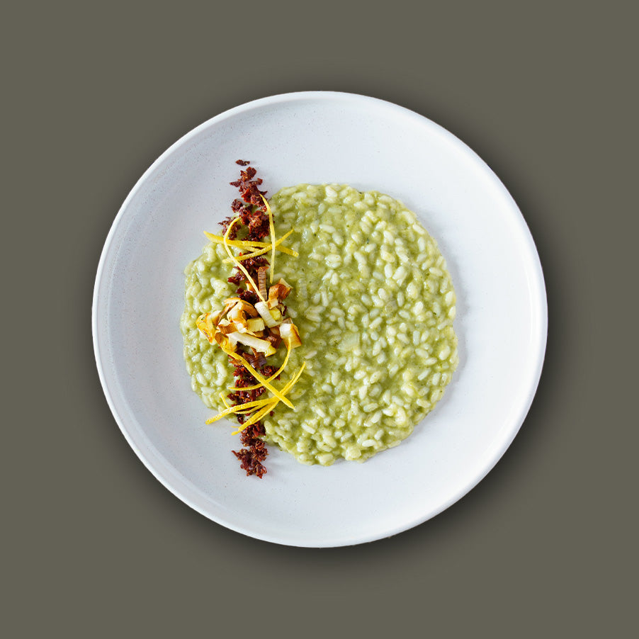 RISOTTO ALLA CREMA DI PORRI CON POLVERE DI SPECK E ZEST DI LIMONE